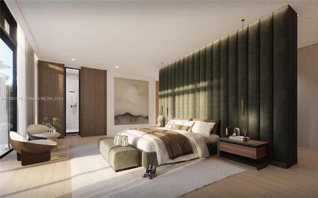 bedroom featuring light hardwood / wood-style floors and a wall of windows