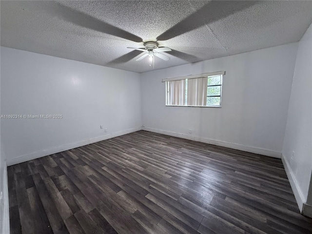 spare room featuring ceiling fan, dark hardwood / wood-style floors, and a textured ceiling