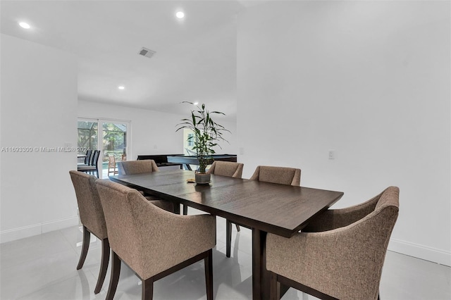 dining space featuring light tile patterned floors