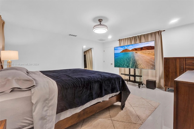 bedroom featuring ceiling fan and light hardwood / wood-style flooring