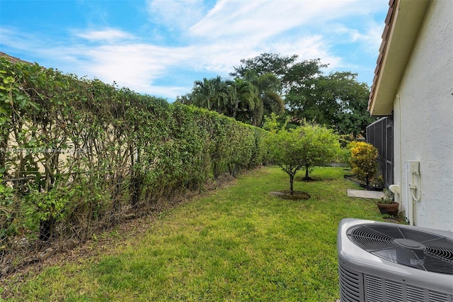 view of yard with central AC unit