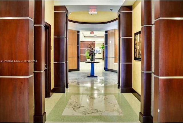 hall featuring ornate columns