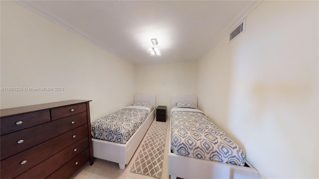 bedroom with ornamental molding