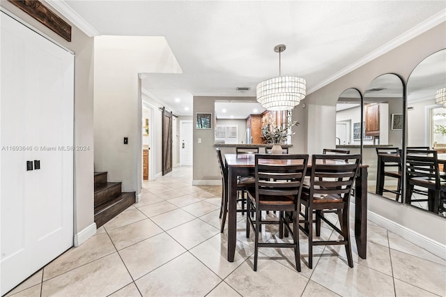 dining area with a barn door, an inviting chandelier, light tile patterned floors, and ornamental molding