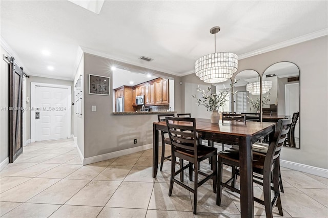 dining room featuring a barn door, light tile patterned floors, a chandelier, and ornamental molding