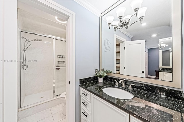 bathroom featuring vanity, toilet, ornamental molding, a notable chandelier, and an enclosed shower