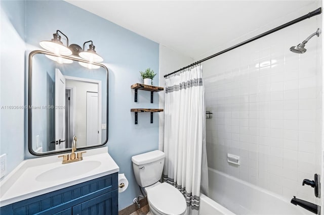 full bathroom featuring vanity, shower / bath combination with curtain, and toilet