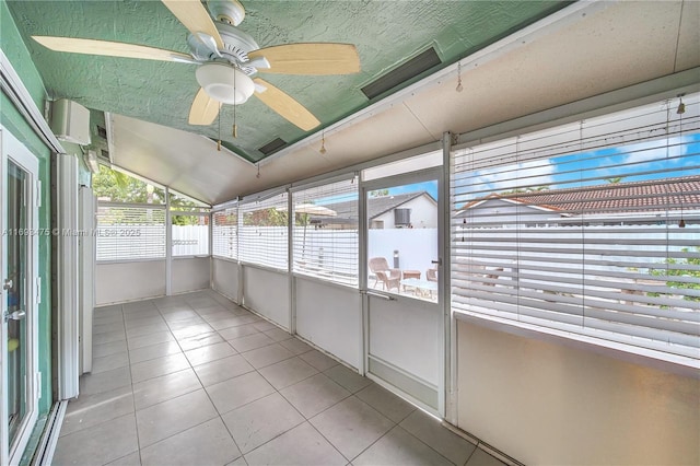 unfurnished sunroom featuring vaulted ceiling and ceiling fan