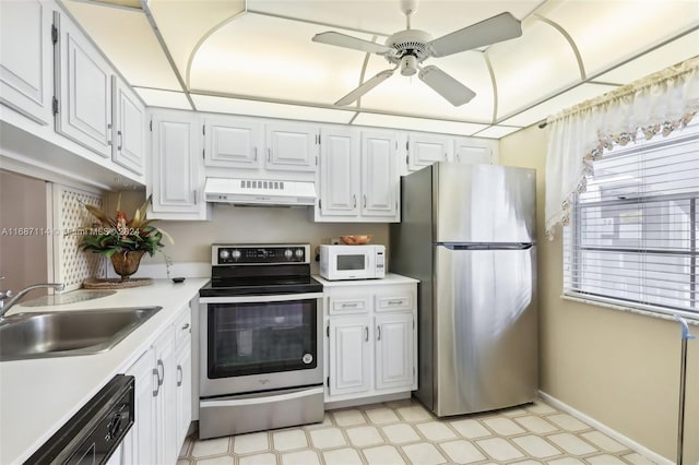 kitchen with appliances with stainless steel finishes, white cabinets, sink, and exhaust hood