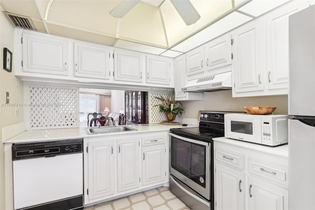 kitchen featuring white cabinets, white appliances, sink, and extractor fan