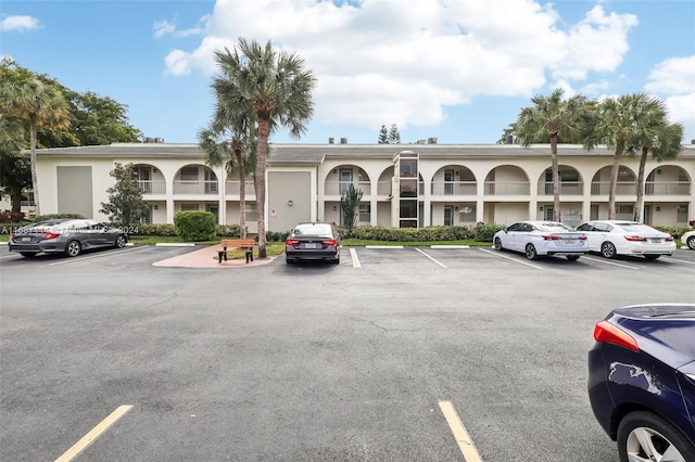2703 Nassau Bnd Unit C2, Coconut Creek, FL 33066 - view of property featuring uncovered parking