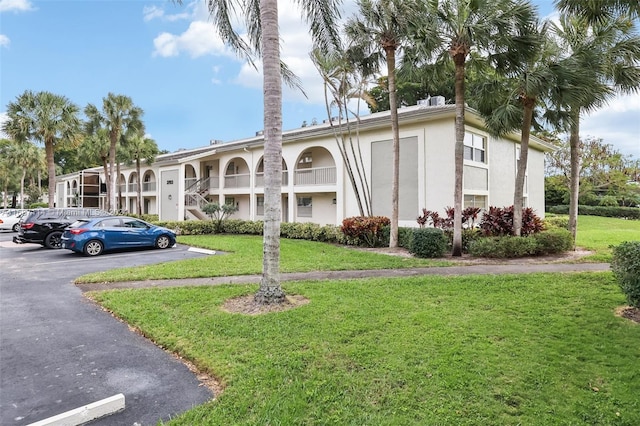 2703 Nassau Bnd Unit C2, Coconut Creek, FL 33066 - view of property with uncovered parking
