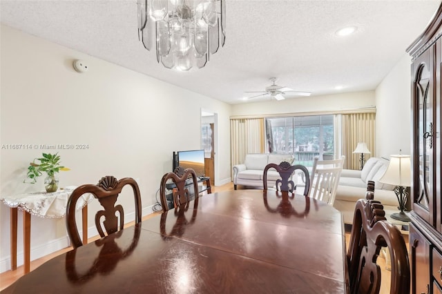 2703 Nassau Bnd Unit C2, Coconut Creek, FL 33066 - dining area featuring a textured ceiling, a chandelier, ceiling fan, and recessed lighting