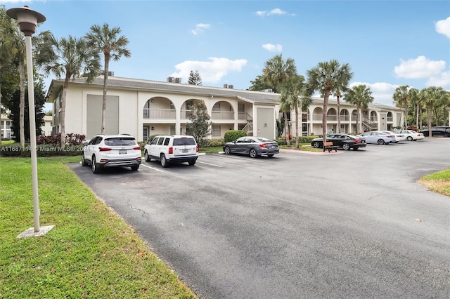 2703 Nassau Bnd Unit C2, Coconut Creek, FL 33066 - view of building exterior with uncovered parking
