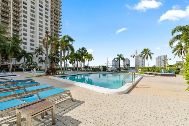 view of swimming pool featuring a patio