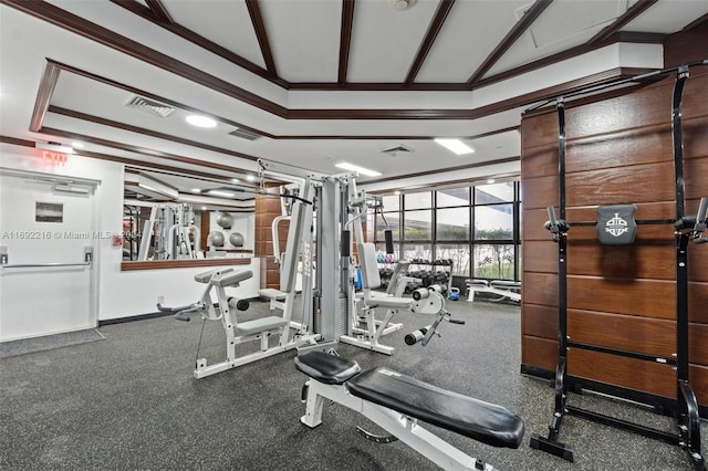 gym featuring crown molding