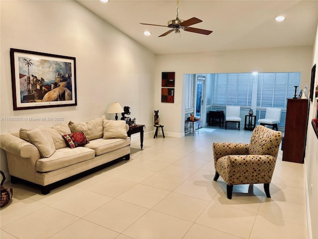 living room with ceiling fan and light tile patterned floors