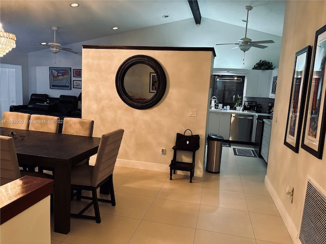 tiled dining area featuring vaulted ceiling with beams and ceiling fan with notable chandelier