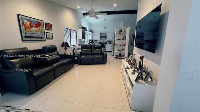 tiled living room featuring ceiling fan and high vaulted ceiling