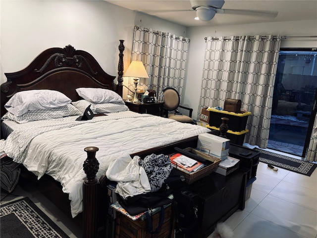 tiled bedroom featuring ceiling fan