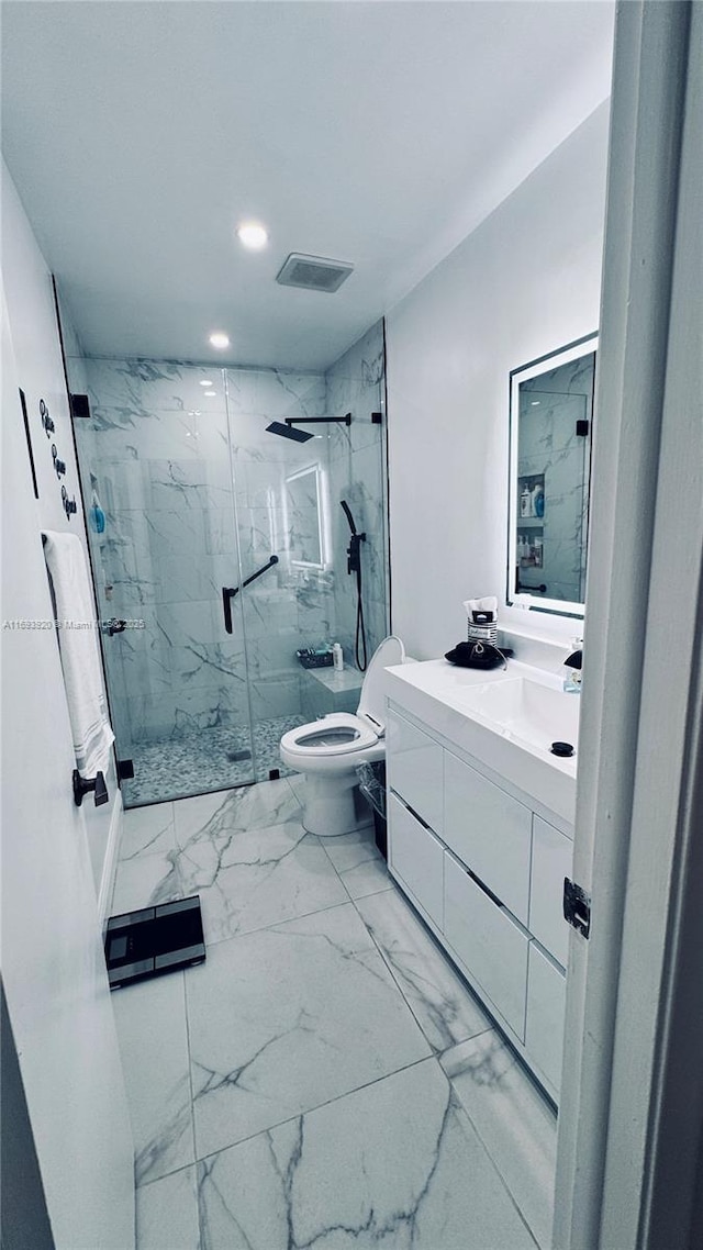 bathroom featuring vanity, toilet, and walk in shower