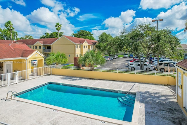 view of swimming pool with a patio area