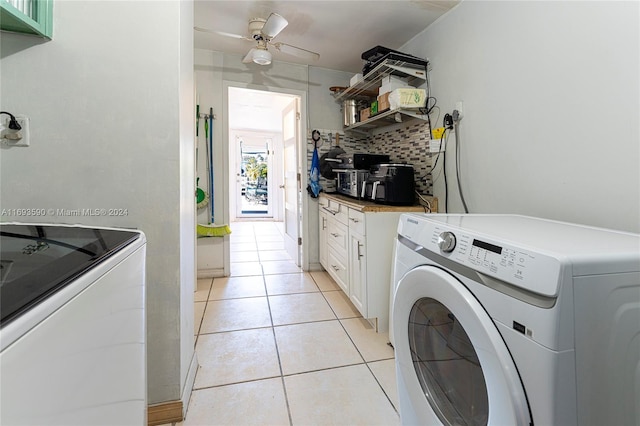 laundry area featuring ceiling fan, light tile patterned flooring, and washer and dryer