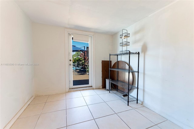 entryway with light tile patterned floors