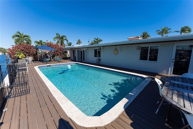 view of pool with a wooden deck