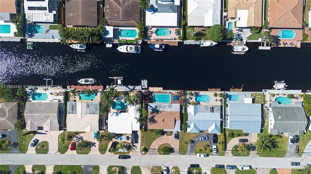 birds eye view of property with a water view