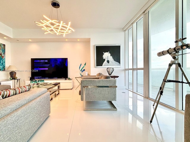 living room with an inviting chandelier, floor to ceiling windows, and light tile patterned flooring