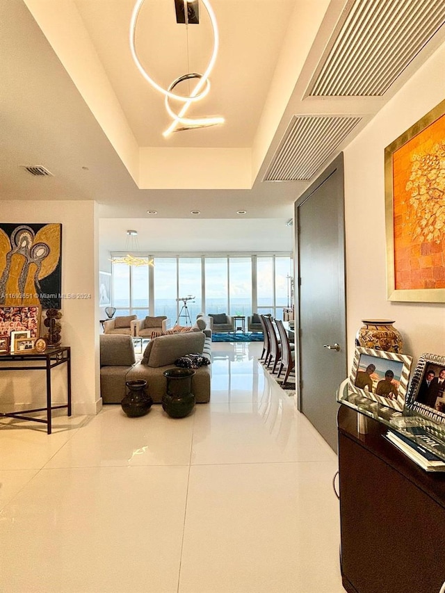 interior space featuring a notable chandelier and light tile patterned floors