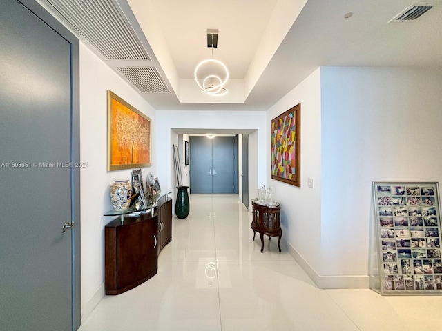 hallway featuring light tile patterned flooring