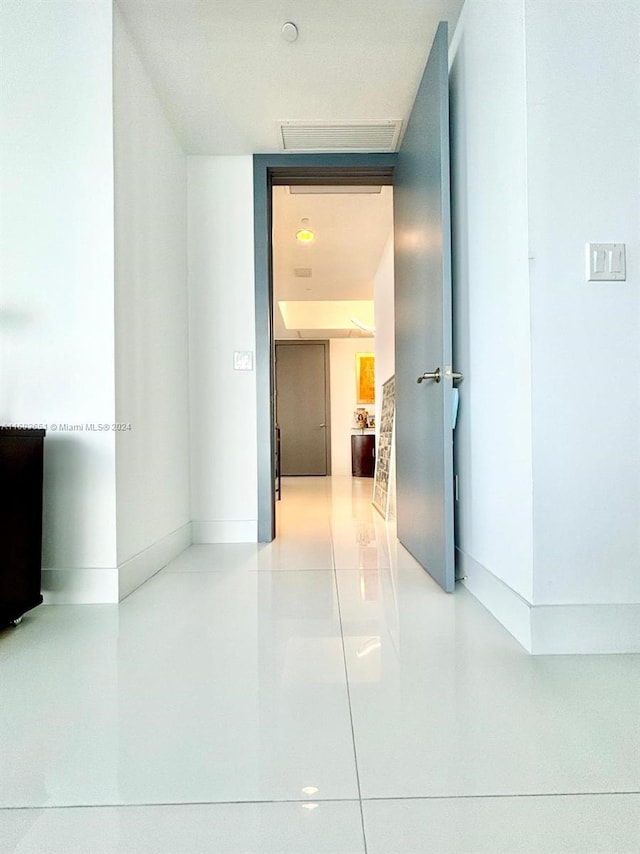 corridor featuring tile patterned floors