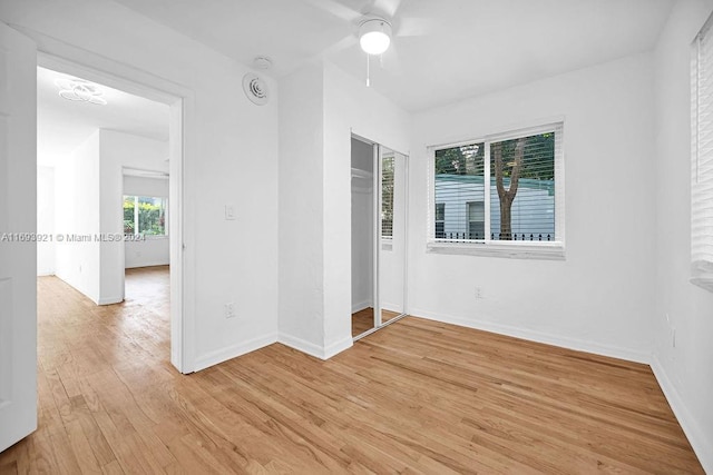 unfurnished room with light hardwood / wood-style flooring and ceiling fan