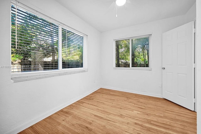 spare room featuring ceiling fan and light hardwood / wood-style floors