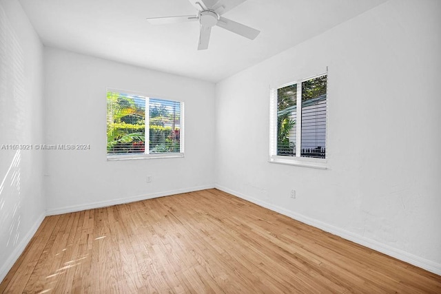 empty room with light hardwood / wood-style floors and ceiling fan