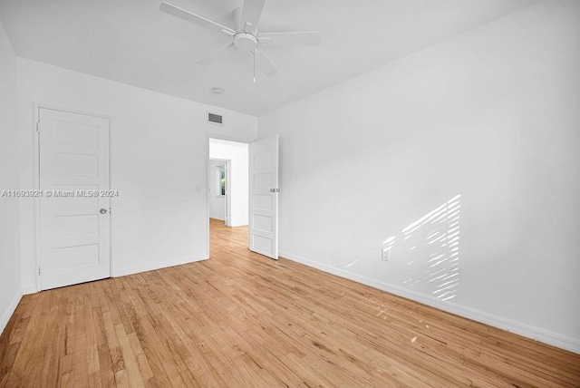 unfurnished room featuring ceiling fan and light hardwood / wood-style floors