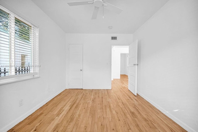 unfurnished bedroom with ceiling fan and light hardwood / wood-style floors