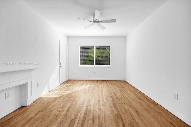 unfurnished living room featuring light wood-type flooring and ceiling fan