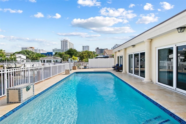 view of swimming pool with a patio area