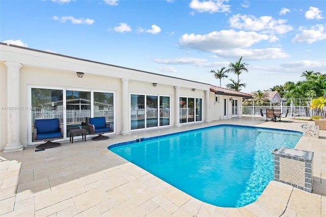 view of pool featuring a patio area