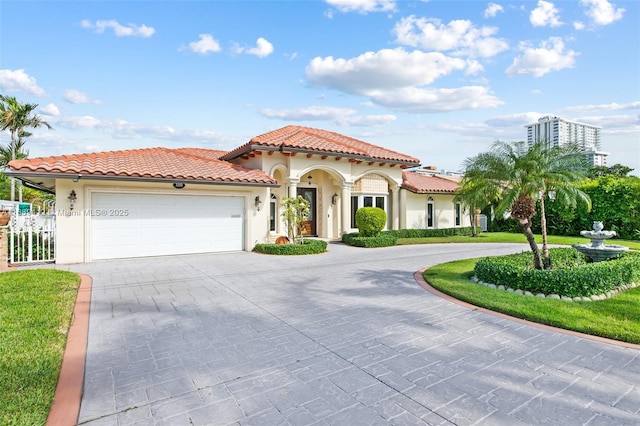 mediterranean / spanish-style house featuring a garage