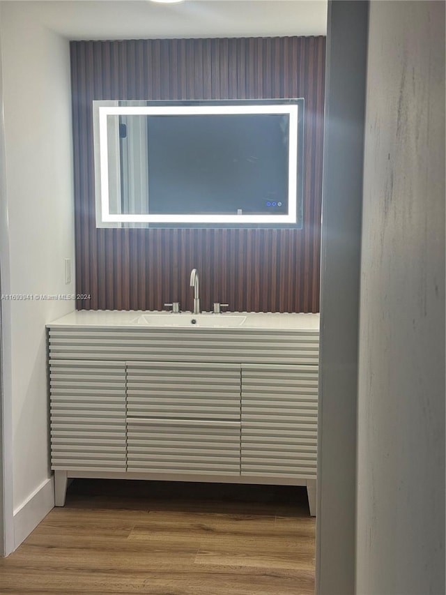 bathroom featuring hardwood / wood-style flooring and vanity