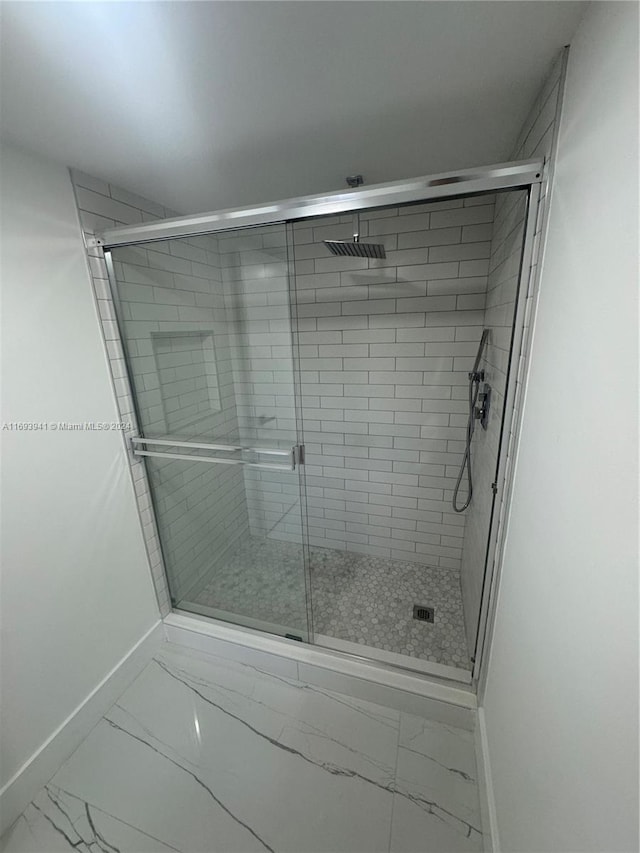 bathroom featuring an enclosed shower