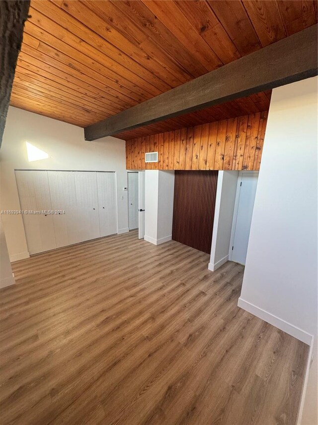 bonus room with beamed ceiling, wood ceiling, and hardwood / wood-style flooring