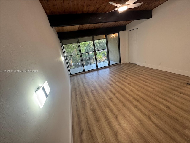 unfurnished room with hardwood / wood-style floors, vaulted ceiling with beams, ceiling fan, and wood ceiling