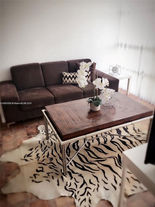 living room with tile patterned flooring