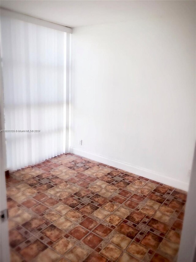 801 Three Islands Blvd Unit 411, Hallandale Beach, FL 33009 - empty room featuring baseboards