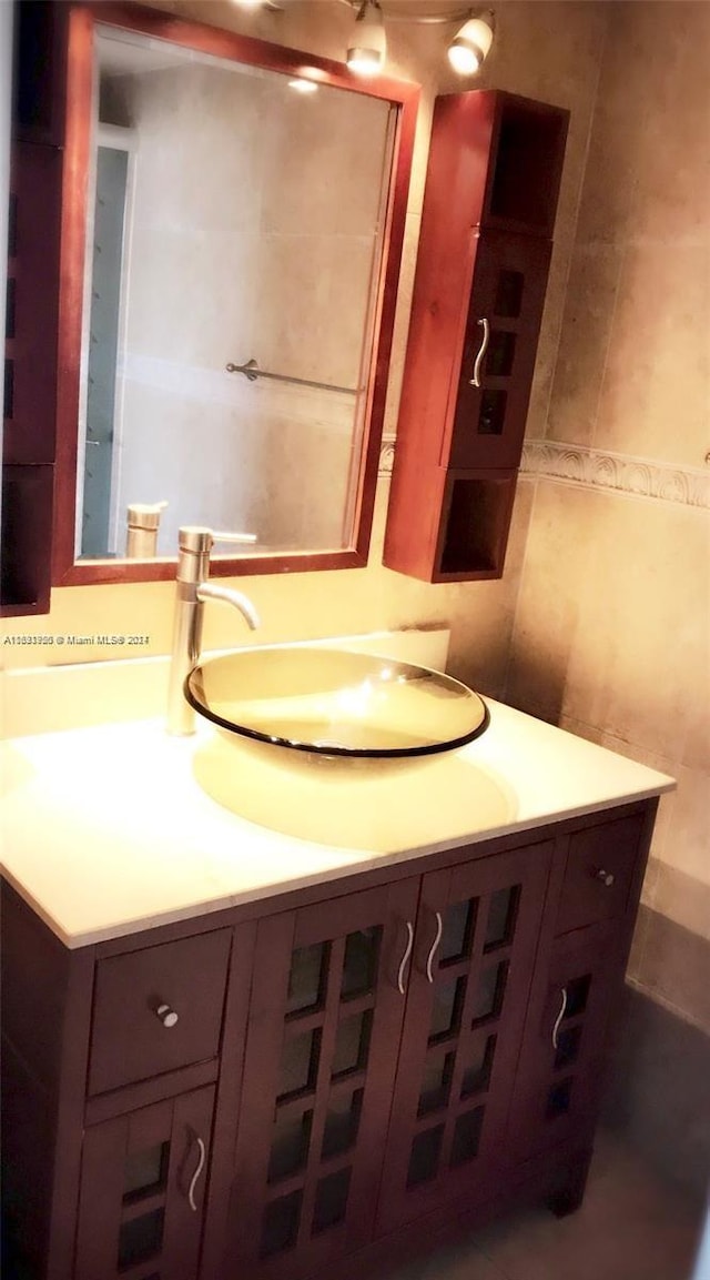 801 Three Islands Blvd Unit 411, Hallandale Beach, FL 33009 - bathroom with vanity and tile walls